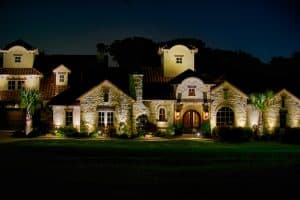 Outdoor lighting illuminates a beautiful University Park home