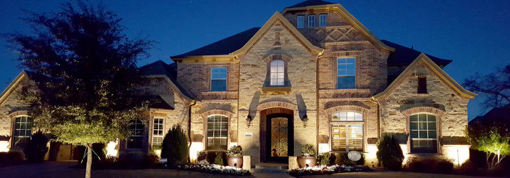 Nice two-story home lit up at night