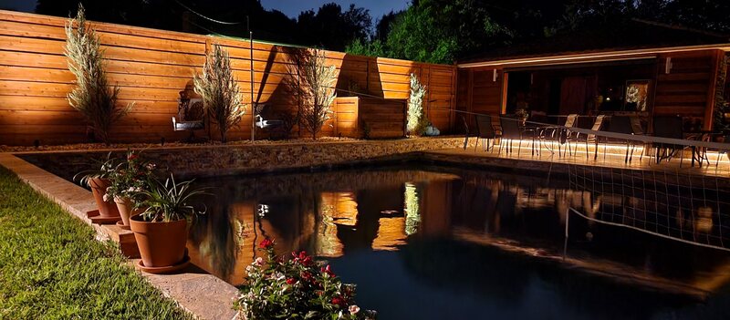 pool lit up by outdoor lighting