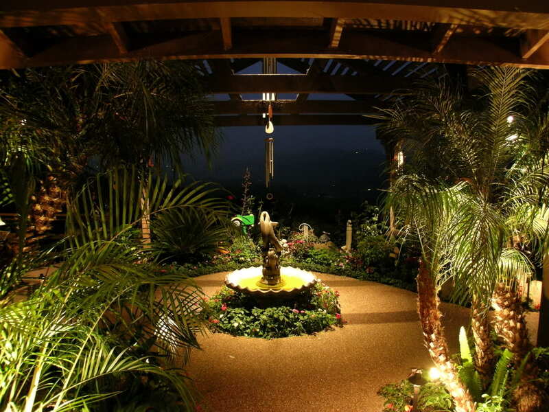 garden area lit up by outdoor lighting