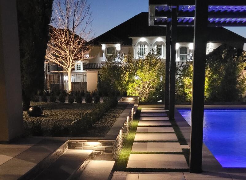 pool lit up with outdoor lighting