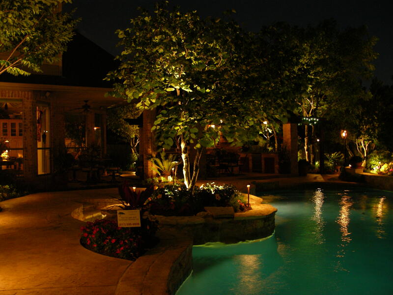 pool surrounded by outdoor lighting