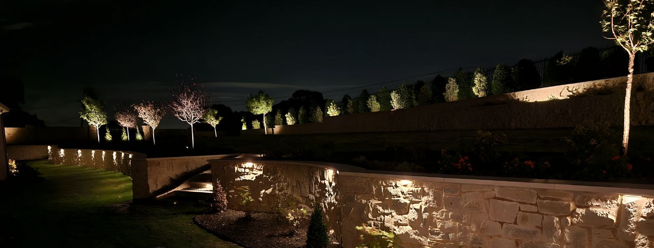 stone walls with outdoor lighting on them